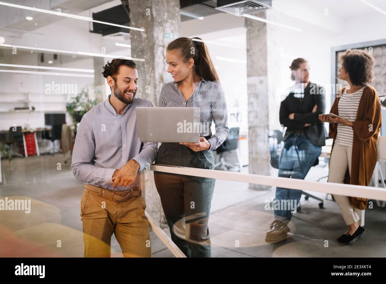 Programmers cooperating brainstorming at information technology company ...