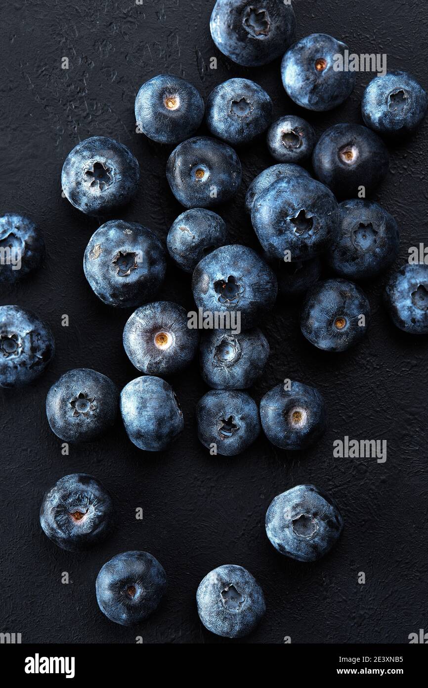 Fresh natural antioxidant blueberries pile, macro detailed close up