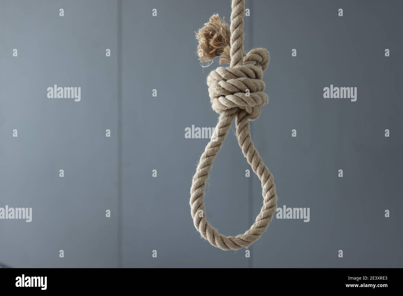 Loop of rope for suicide hanging on ceiling of house Stock Photo