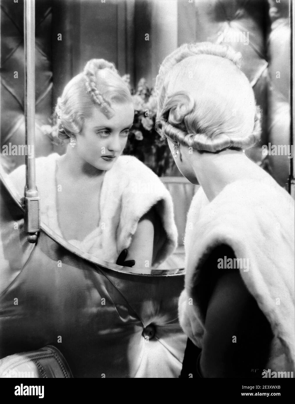 BETTE DAVIS portrait in FASHIONS OF 1934 director WILLIANM DIETERLE gowns Orry-Kelly musical numbers Busby Berkeley First National Pictures / Warner Bros. Stock Photo
