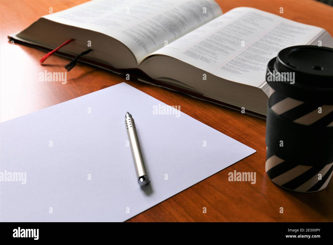 person writing on a notebook Stock Photo
