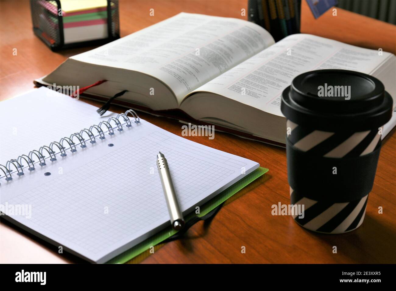person writing on a notebook Stock Photo