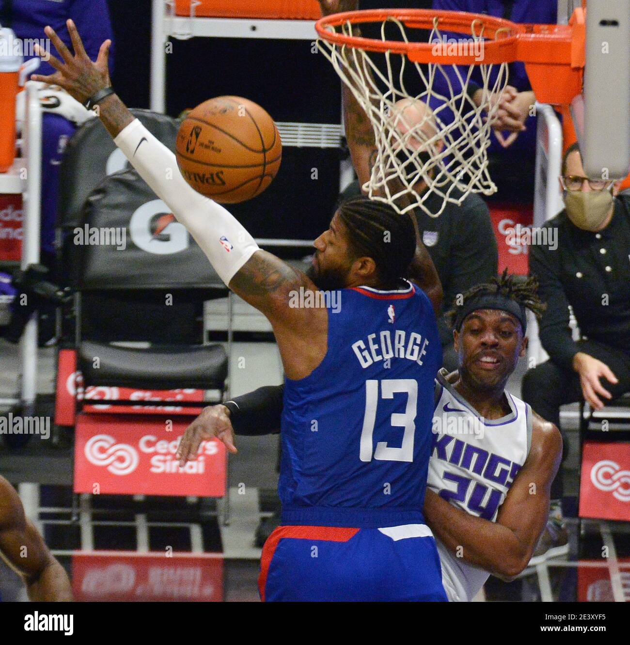 Los Angeles, United States. 20th Jan, 2021. Sacramento Kings' guard Buddy Hield passes around Los Angeles Clippers' forward Paul George during the second quarter at Staples Center in Los Angeles on Wednesday, January 20, 2021. The Clippers defeated the Kings 115-96. Photo by Jim Ruymen/UPI Credit: UPI/Alamy Live News Stock Photo