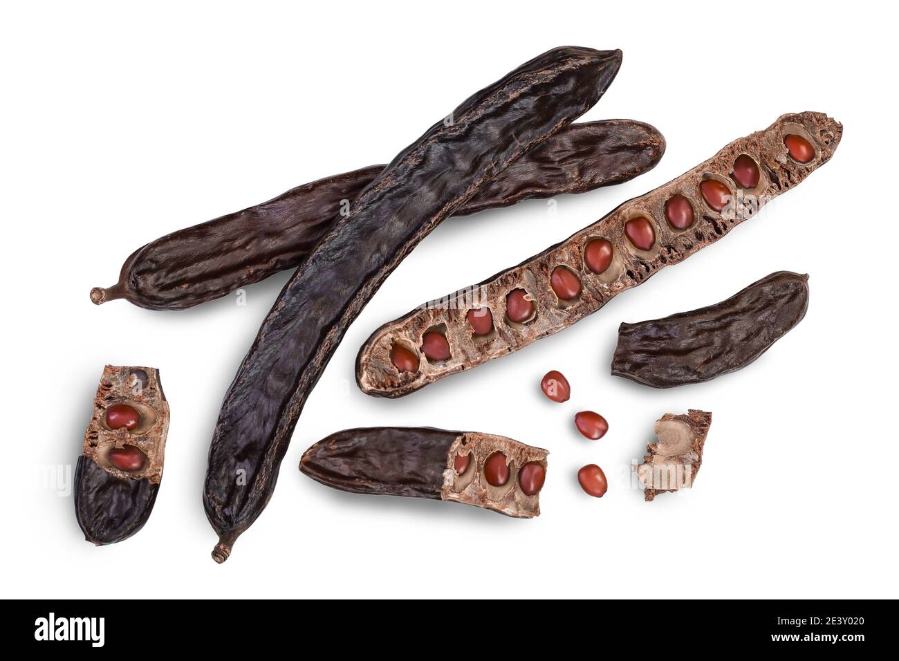 Ripe carob pods and bean isolated on white background with clipping