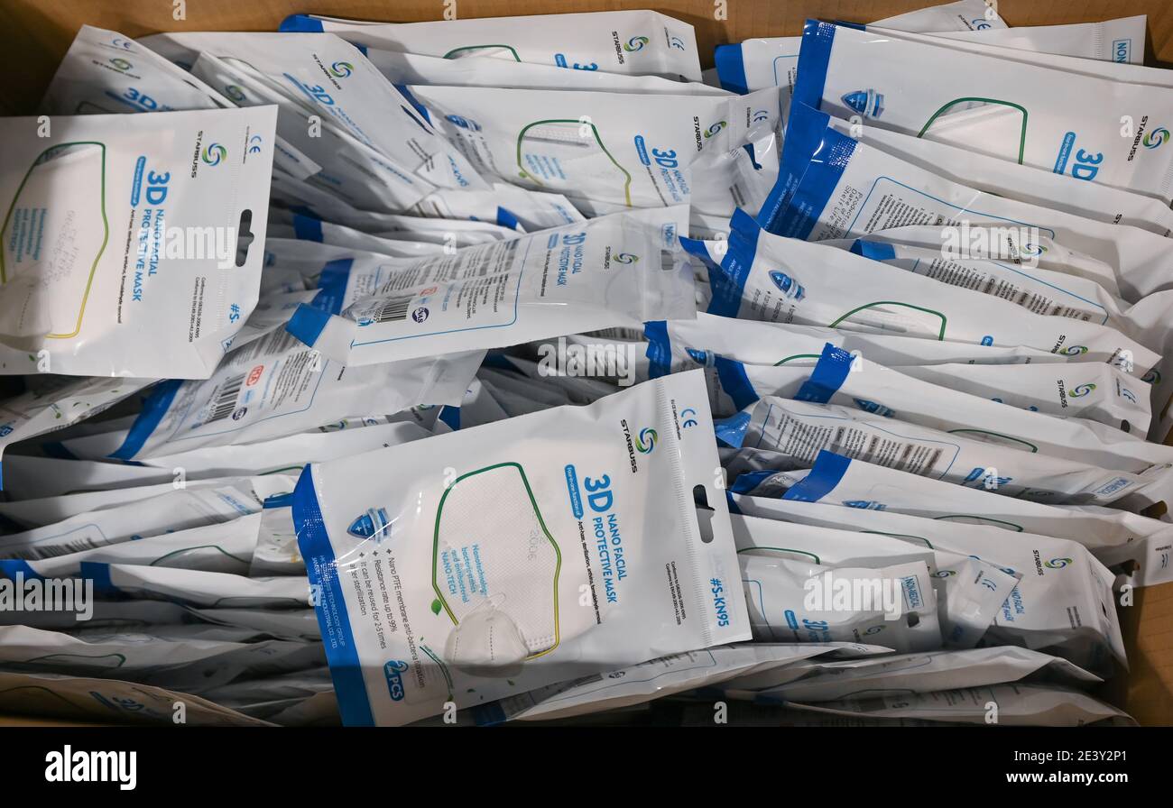 Heuchelheim, Germany. 21st Jan, 2021. KN95 masks are individually packed in a box at the entrance to the vaccination centre. The first six regional vaccination centres in Hesse have been open since 19 January. Credit: Arne Dedert/dpa/Alamy Live News Stock Photo