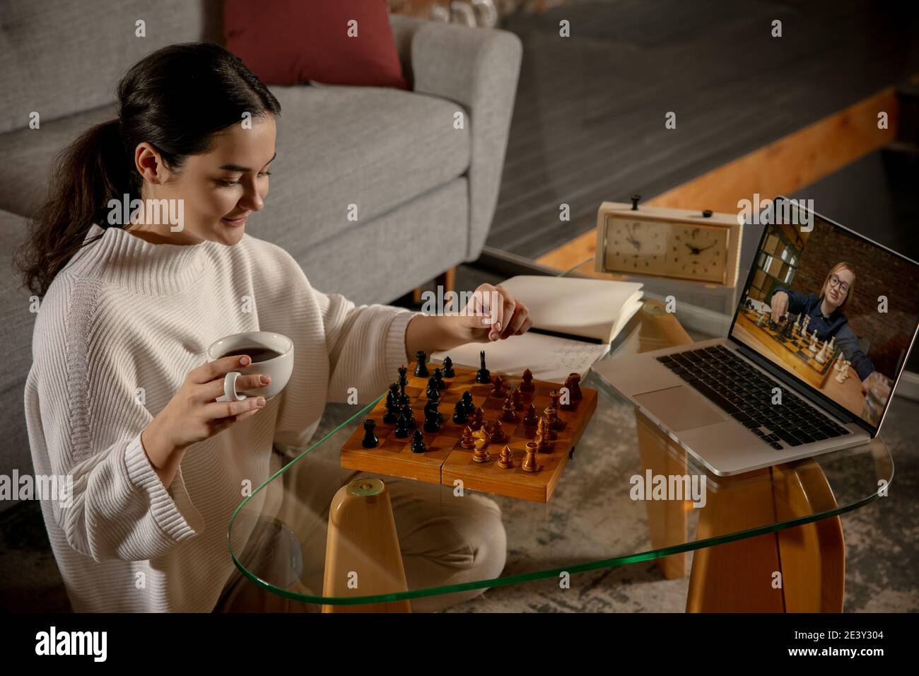 Play Chess Set Of Landing Pages Two People Plays Chess Online From Computer  And Smartphones Girl Sitting Cross Legs With Chessboard Figures And Book  Girl Sitting With Chessboard And Chess Figures Stock