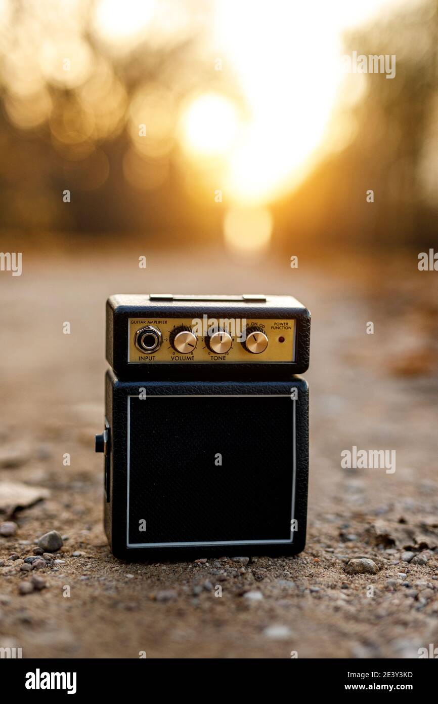 Guitar amp with orange nature background Stock Photo - Alamy