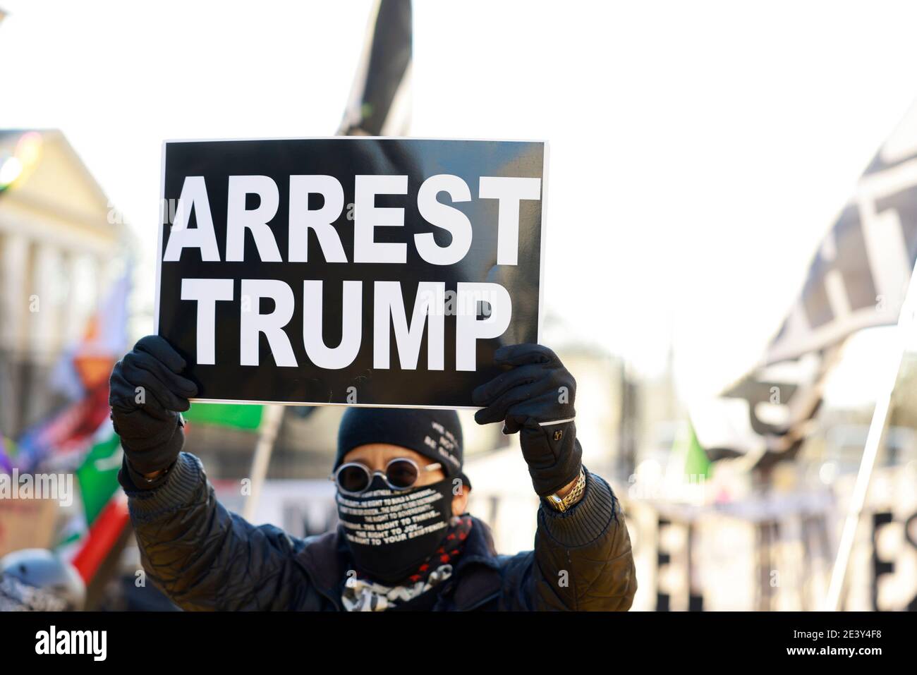 Activist Laurie Arbeiter holds a sign reading 'Arrest Trump' at Black Lives Matter Plaza after the departure of Donald J. Trump’s helicopter at the white house on the inauguration day of President Joe Biden and Vice President Kamala Harris. Stock Photo