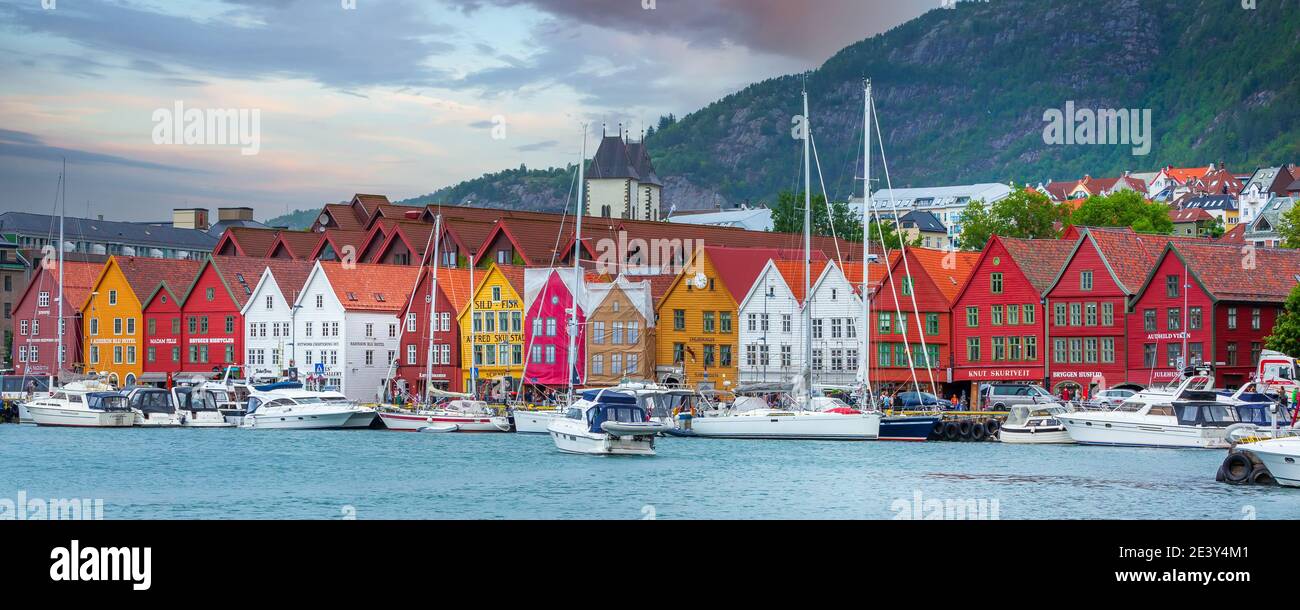 Bergen, Norway - July 30, 2018: City street Bryggen panoramic banner, boats and colorful traditional nordic houses Stock Photo