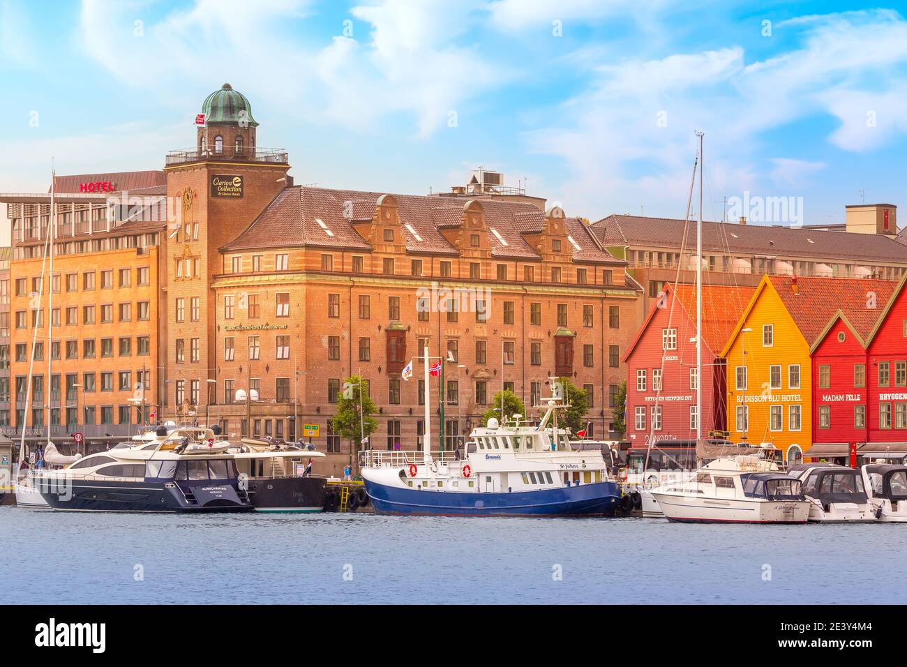 Bergen, Norway - July 30, 2018: City street Bryggen, boats and colorful traditional nordic houses Stock Photo