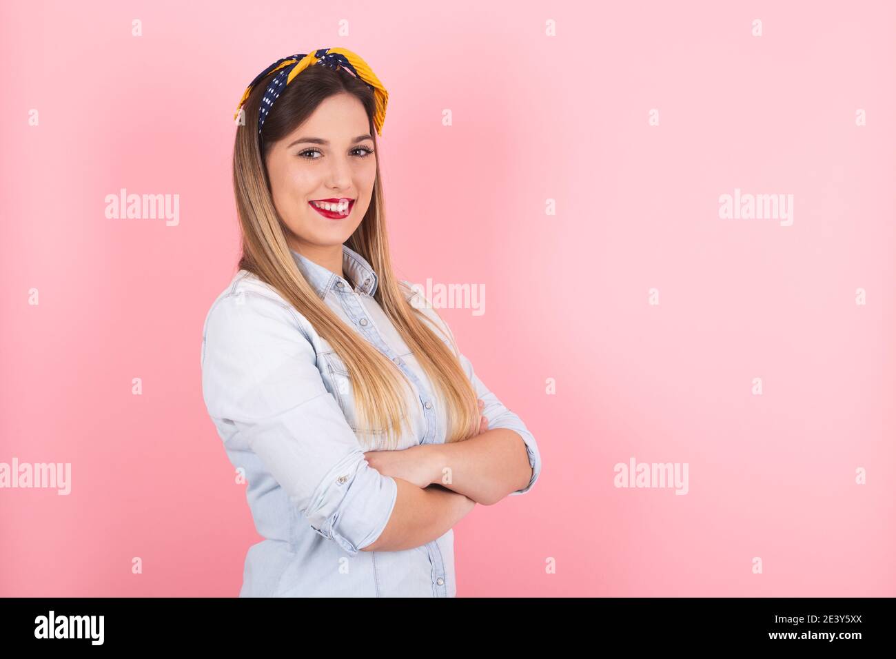 Young pin up woman shows off her smiling face Stock Photo