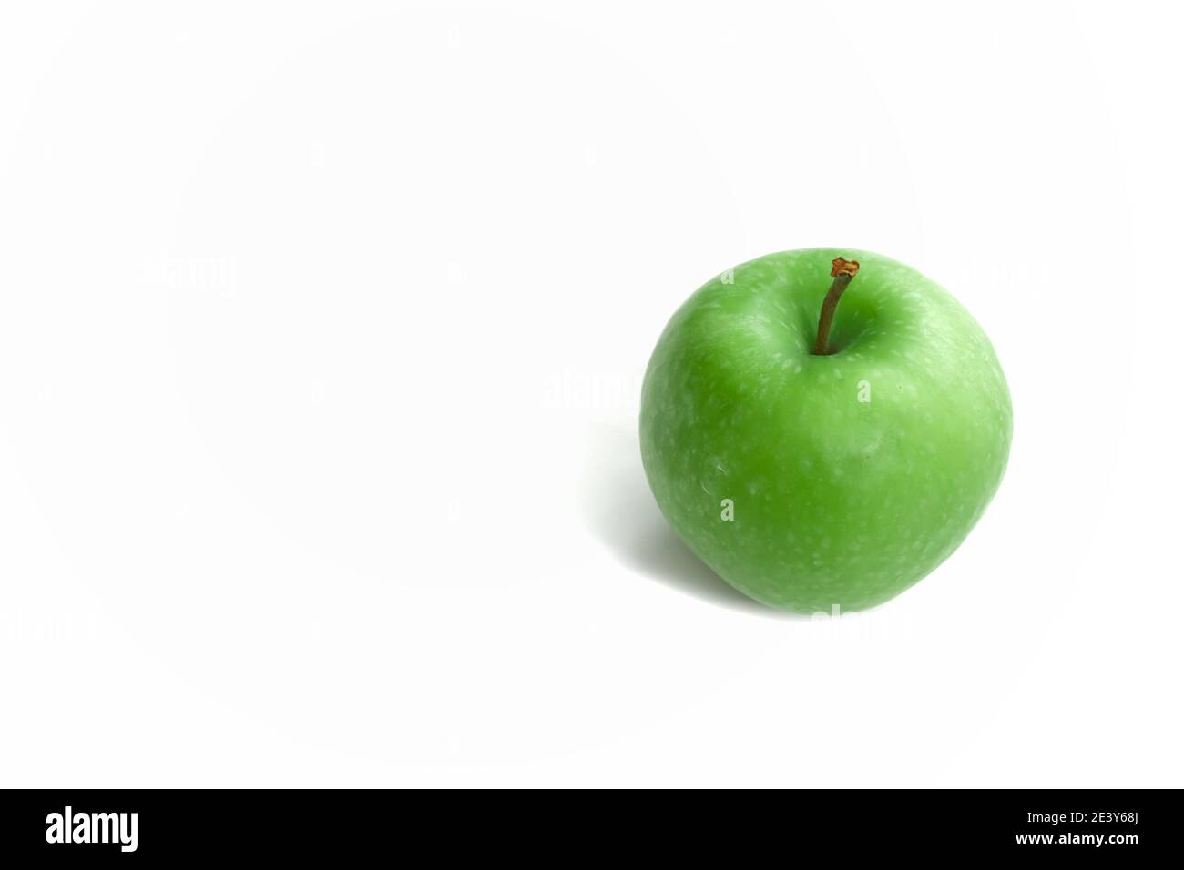 Fresh green apple isolated on white background with space for text. Healthy foods or snack. Stock Photo