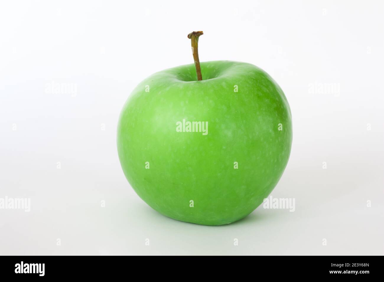 Fresh green apple isolated on white background with space for text. Healthy foods or snack. Stock Photo