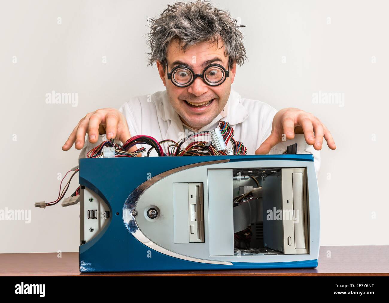 Crazy engineer or scientist repairing desktop computer Stock Photo - Alamy