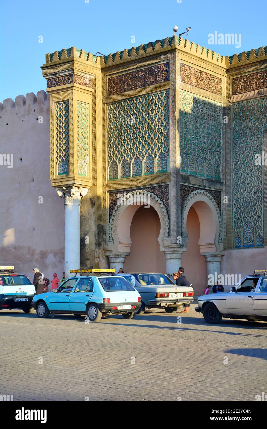 Meknes, Morocco - November 19th 2014: Unidentified people and petit taxis in front of Bab el-Mansour Stock Photo
