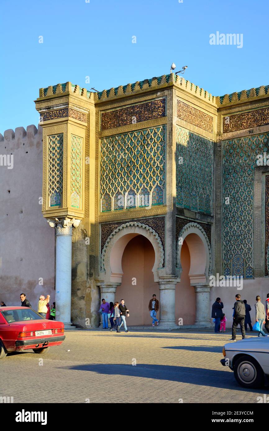 Meknes, Morocco - November 19th 2014: Unidentified people in front of impressive Bab el-Monsour gate, a tourist attraction in the city Stock Photo