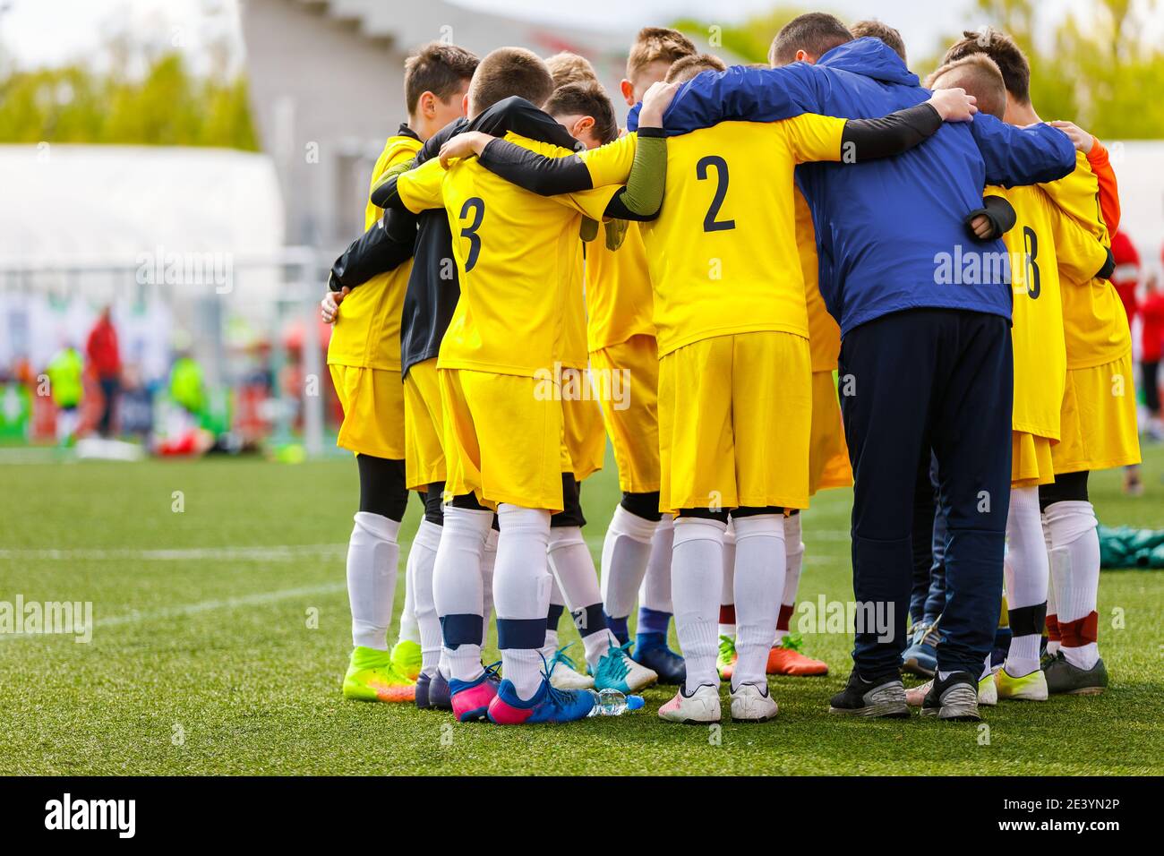 Teenage Boys in Sports Team. Boys Huddling in a Circle with Coach