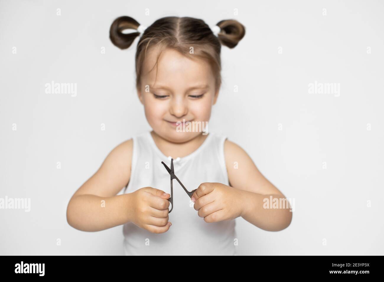 Children's manicure, nail care, hand hygiene. Trimming the nails with ...