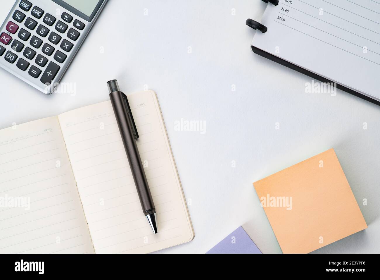 Topview of notebook with pen, calculator and sticky note Stock Photo ...