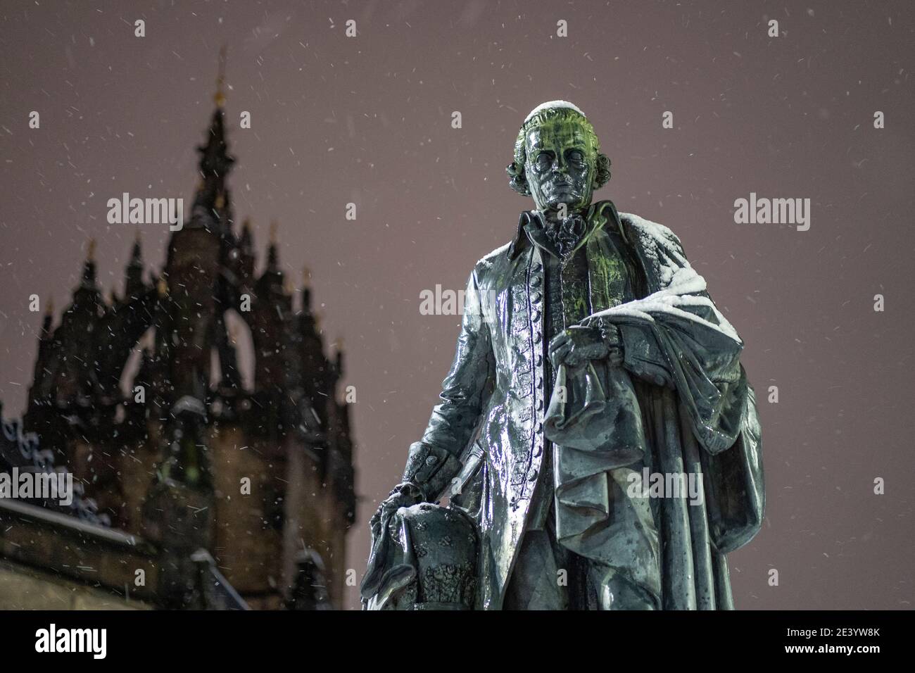 Edinburgh, Scotland, UK. 21 January 2020. Scenes taken between 4am and 5am in Edinburgh city centre after overnight snow fall. Statue of Adam Smith on royal Mile covered in snow. Iain Masterton/Alamy Live News Stock Photo