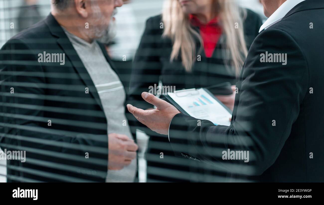 close up . business people talking standing in the office. Stock Photo