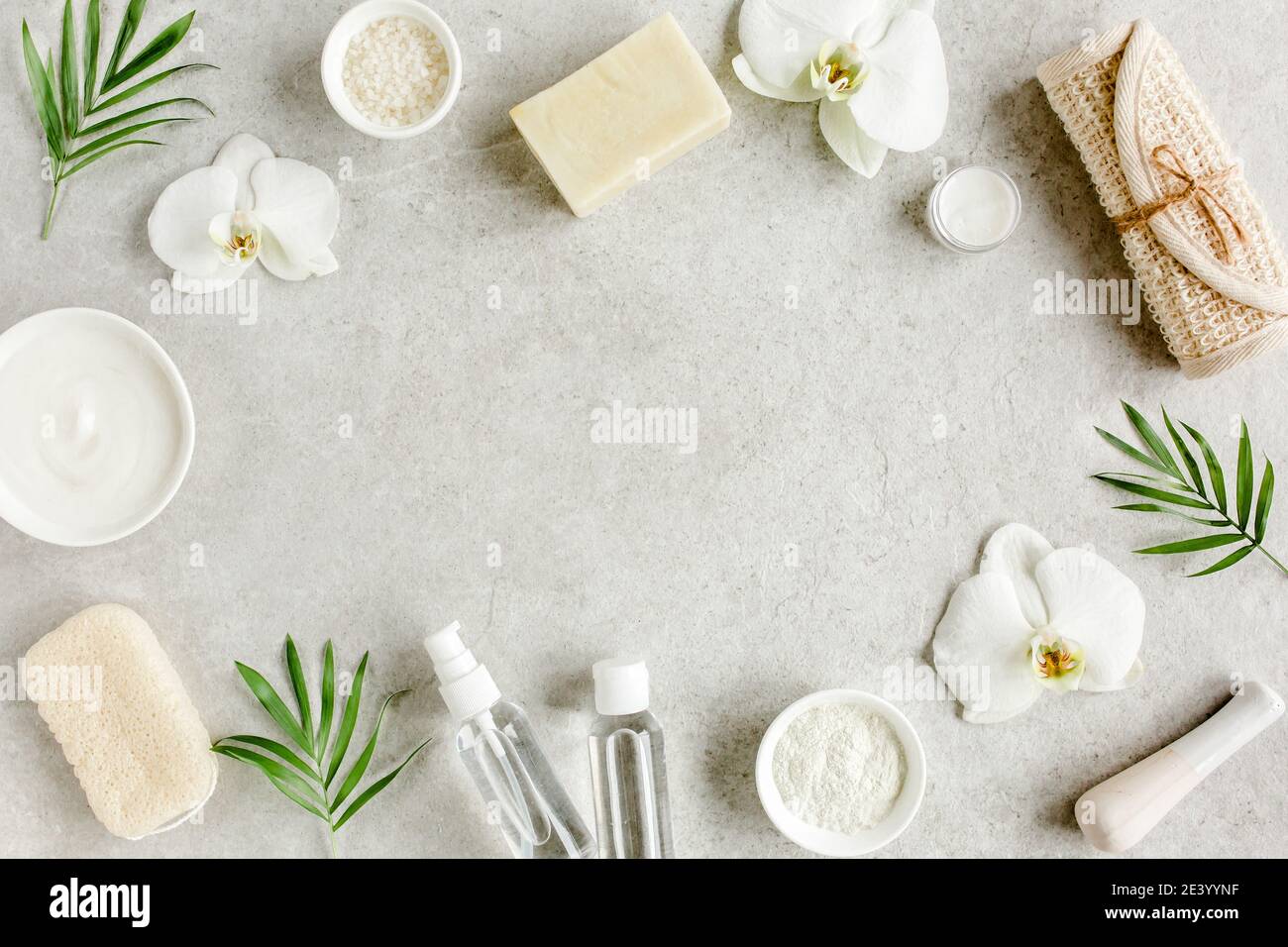 Spa treatment concept. Natural,Organic spa cosmetics products, sea salt, massage brush. Spa background with a space for a text, flat lay, top  Stock Photo