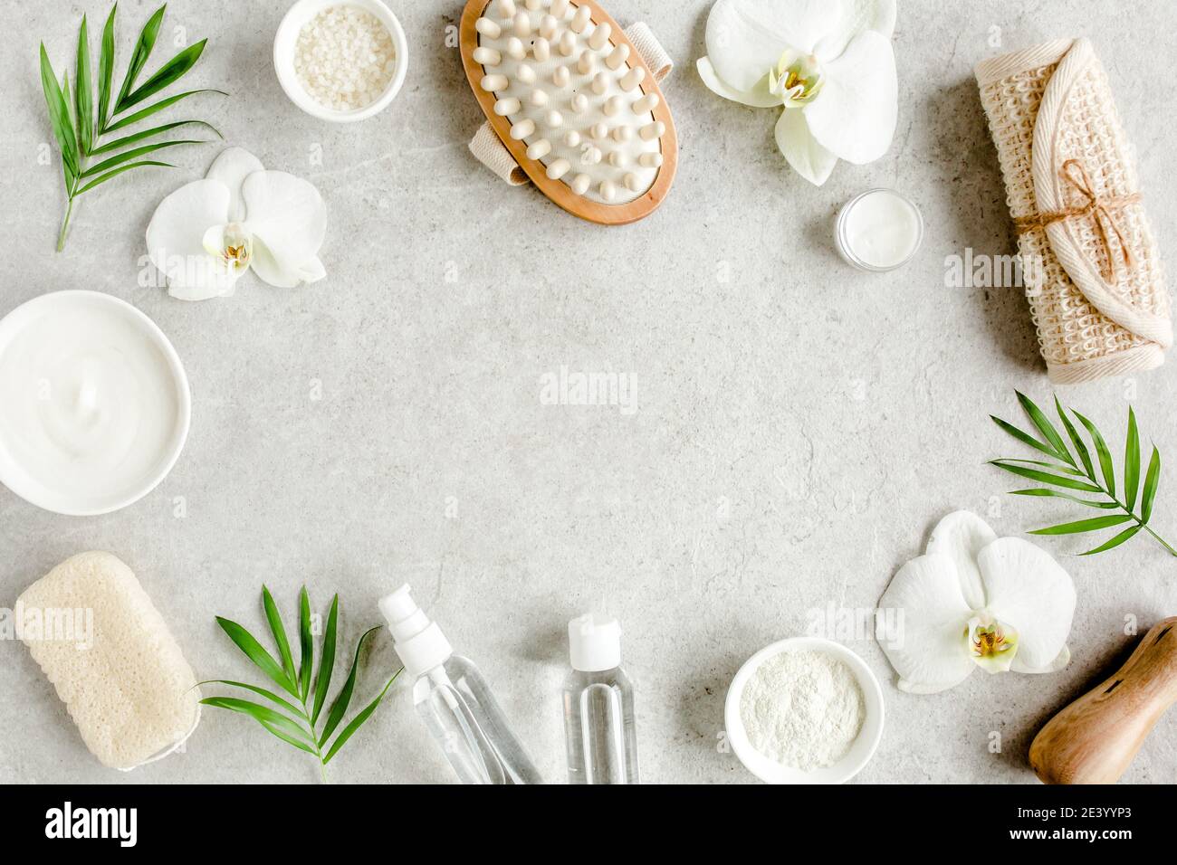 Spa treatment concept. Natural,Organic spa cosmetics products, sea salt, massage brush. Spa background with a space for a text, flat lay, top  Stock Photo
