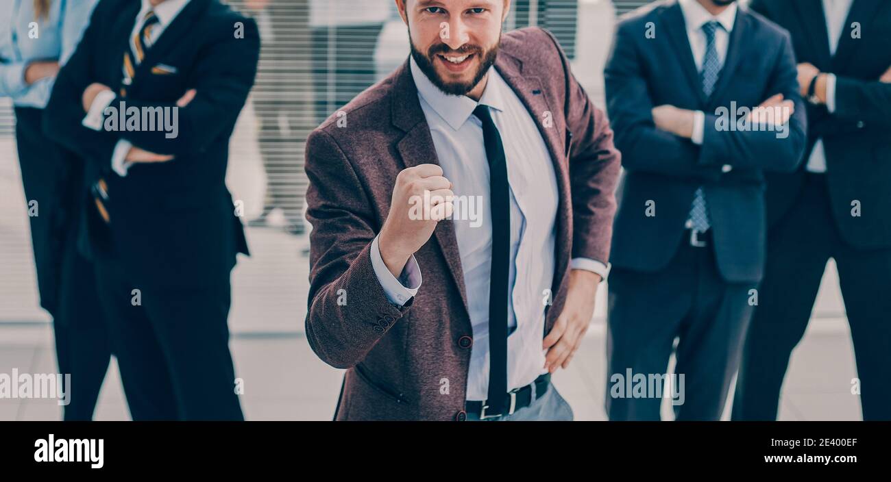 happy leader standing in front of his business team Stock Photo - Alamy