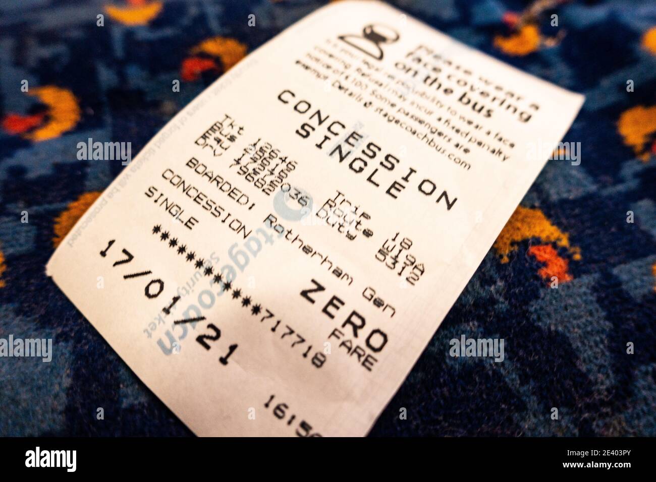 Old aged pensioners free bus pass ticket left on a bus seat Stock Photo