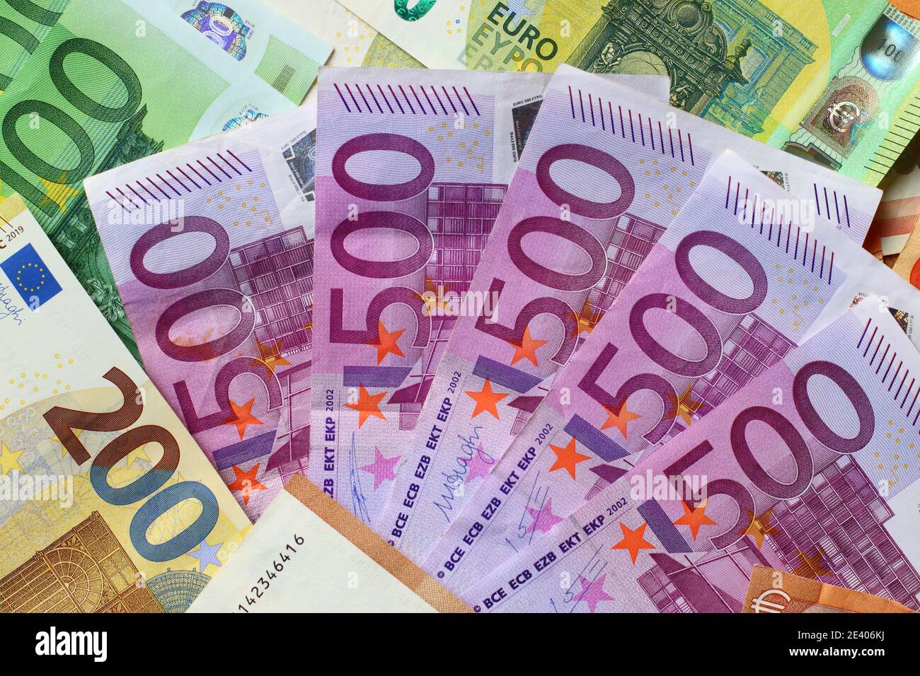 Euro currency banknotes background. European paper money texture with 100, 200 and 500 euros bills. Stock Photo