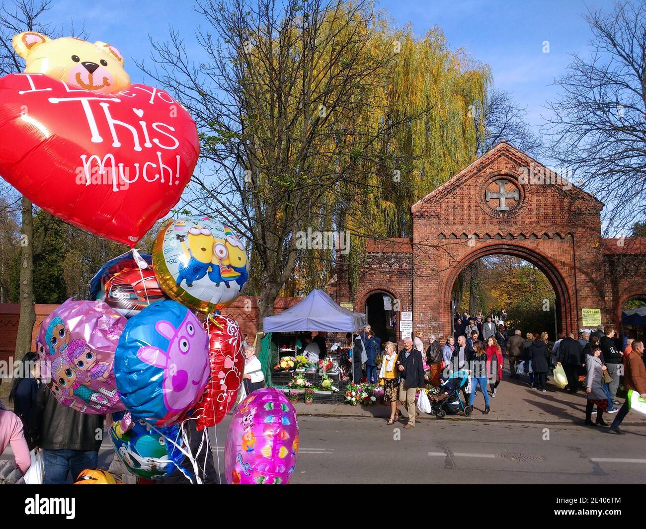 BYTOM, POLAND - NOVEMBER 1, 2018: People visit graves during All Saints Day in Bytom. All Saints Day celebrations at cemeteries is one of most importa Stock Photo