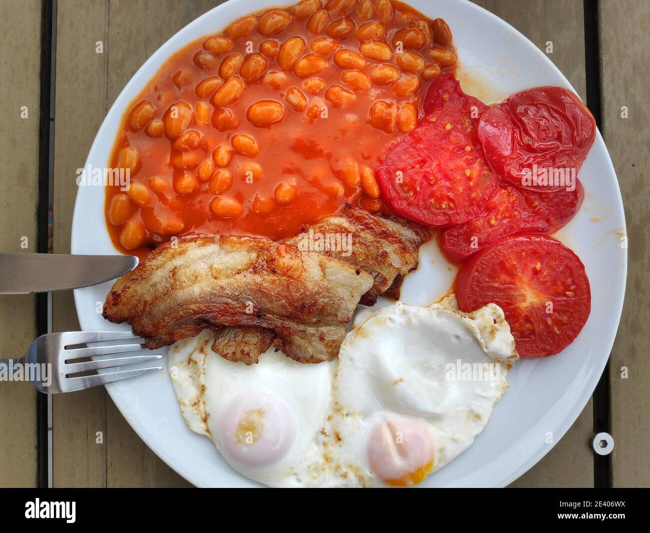 English breakfast. Traditional morning meal with bacon, beans, fried