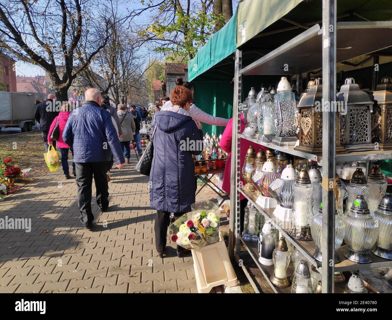 BYTOM, POLAND - NOVEMBER 1, 2019: People buy grave candles during All Saints Day in Bytom. All Saints Day celebrations at cemeteries is one of most im Stock Photo