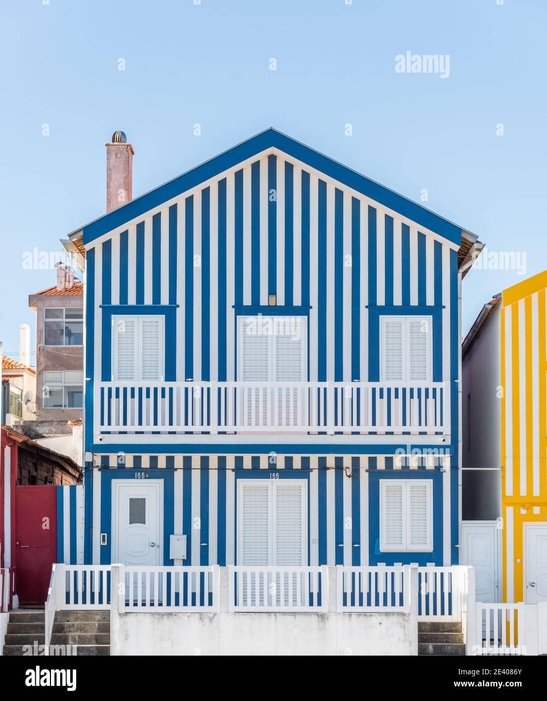 colorful image Typical stripes Houses in Costa Nova, Aveiro, Barra, Portugal Stock Photo