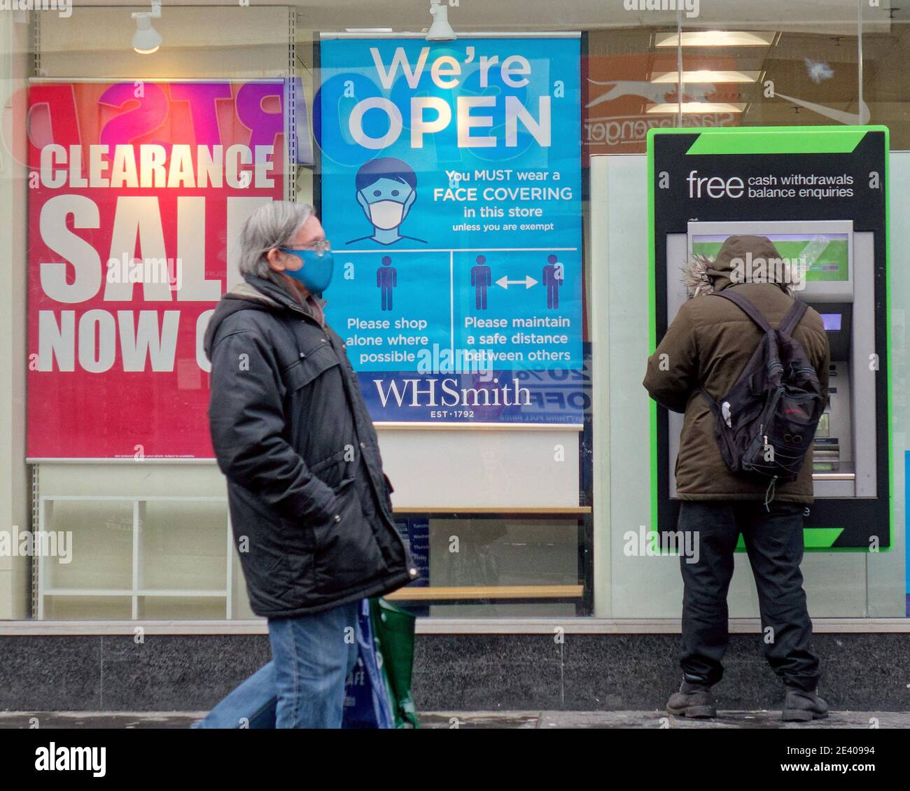 Glasgow, Scotland, UK. 21st January, 2021.Lockdown Thursday was wet and finally saw police walking the city centre with the new rules, mask signs everywher W h Smith has signs at eye level outlining the protocols for inside the store.  Credit Gerard Ferry/Alamy Live News Stock Photo