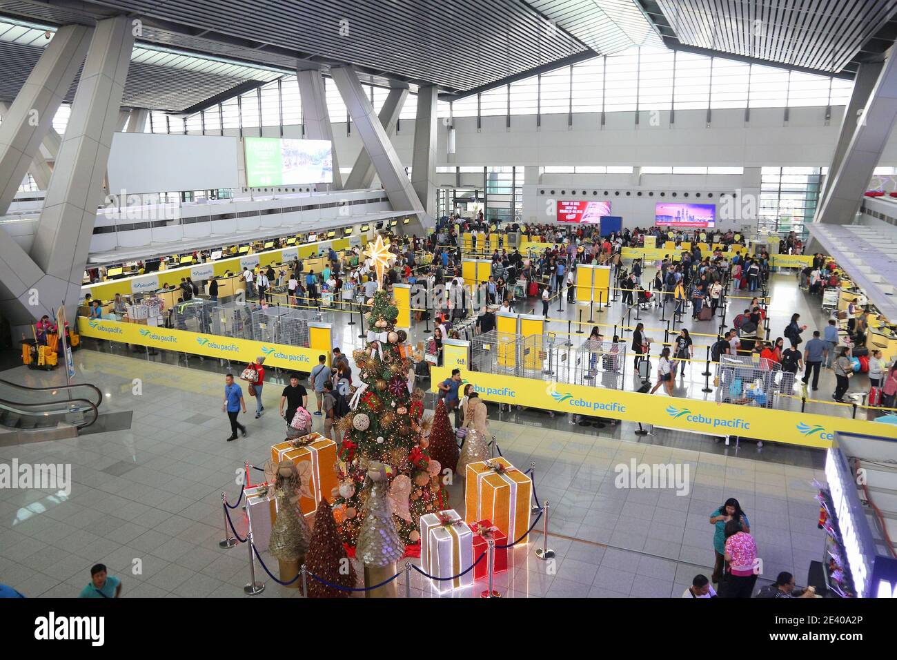 MANILA, PHILIPPINES - DECEMBER 8, 2017: People wait at Ninoy Aquino International Airport in Manila, Philippines. The airport handles 36.7 million pas Stock Photo