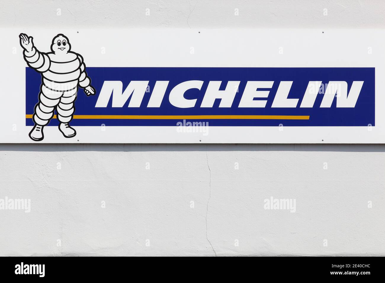 Munster, Germany - July 22, 2018: Michelin logo on a wall. Michelin is a tire manufacturer based in Clermont-Ferrand in France Stock Photo