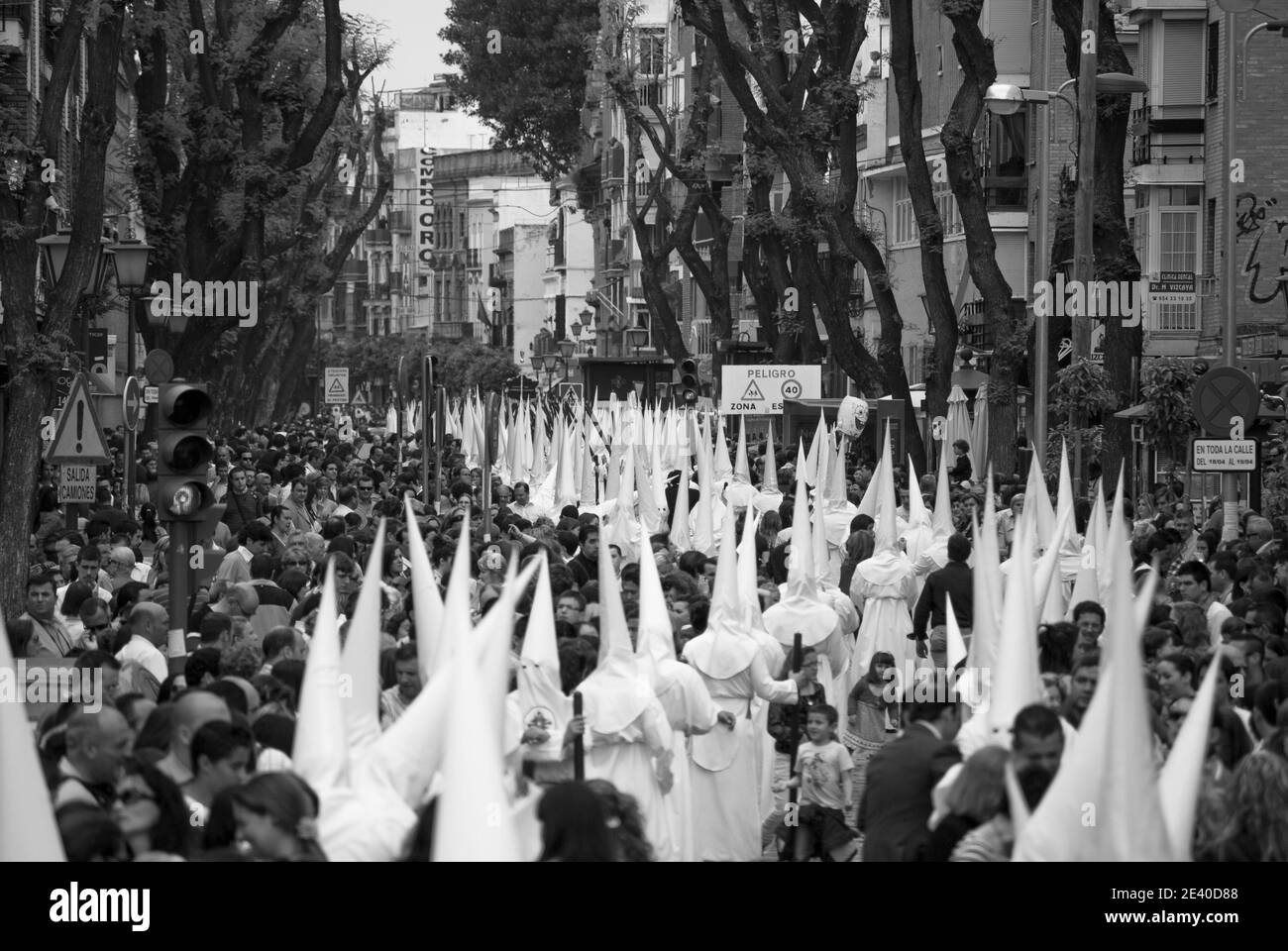 The crowd follows the street processions at Easter Stock Photo