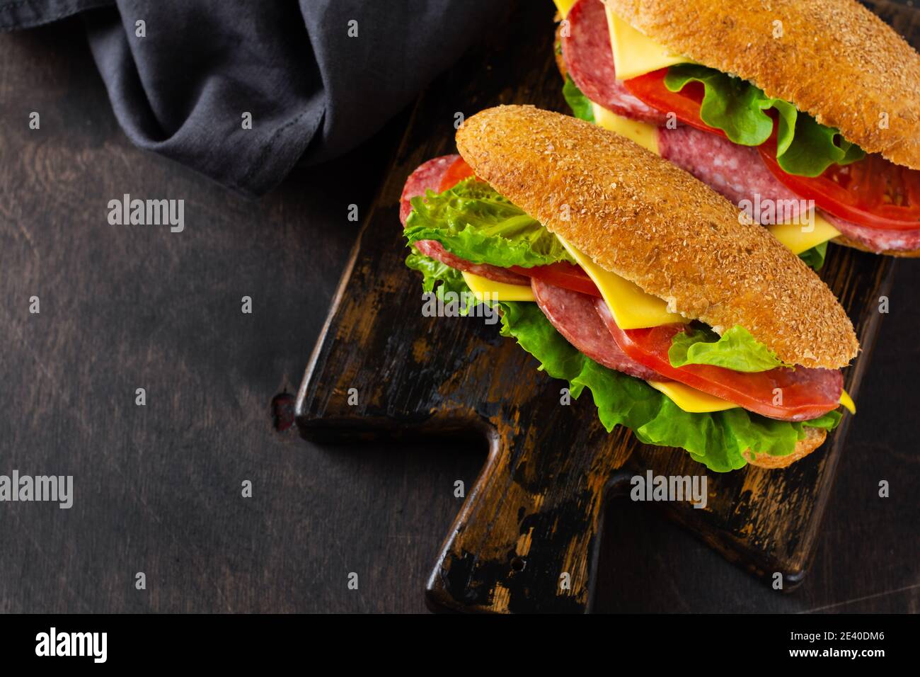 Healthy sandwiches with bran bread, cheese, green lettuce, tomato and