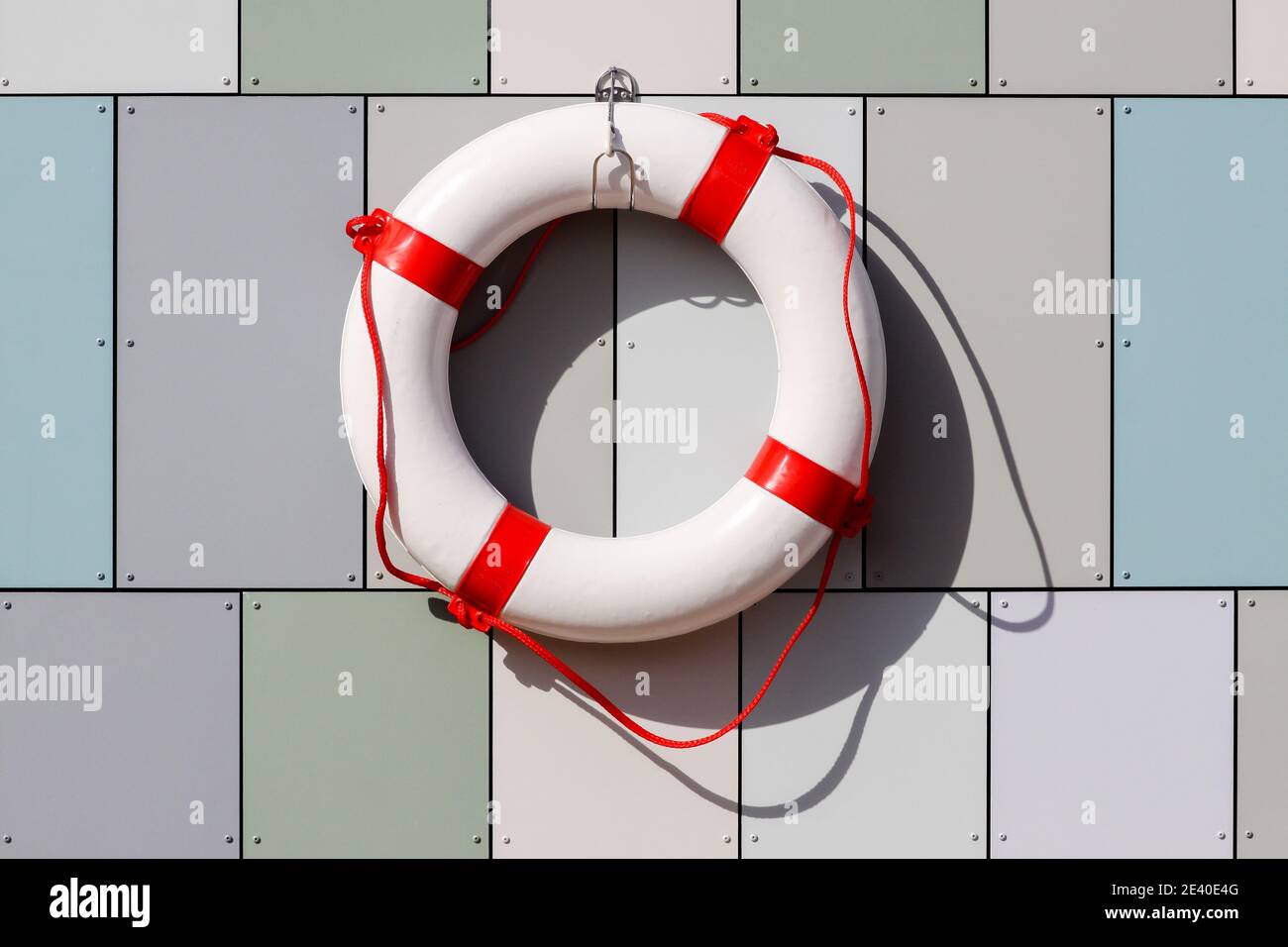 Lifebuoy hanging on a wall in Denmark Stock Photo