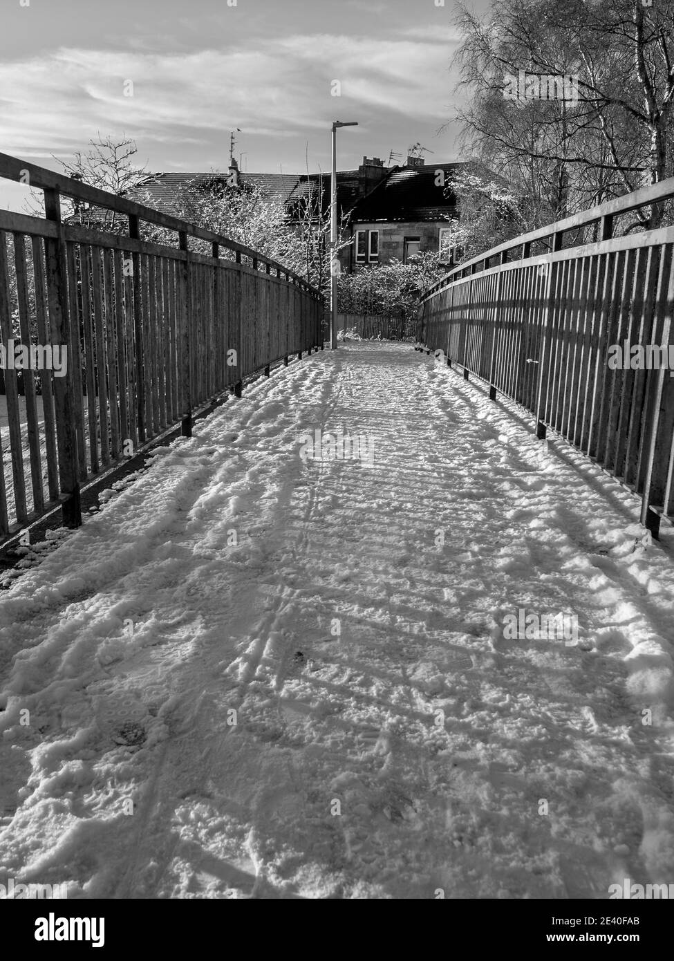 A black and white photograph of a snowy pathway in Rutherglen. Stock Photo