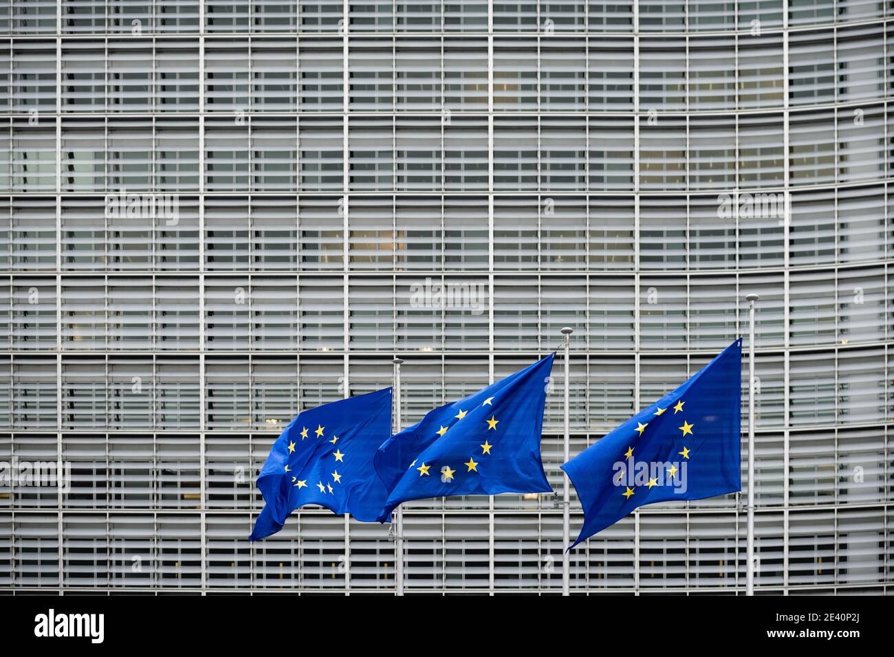 BR, BELGIUM - Jan 18, 2021: The flags of the European Union in front of the Le Berlaymont / headquarters Stock Photo