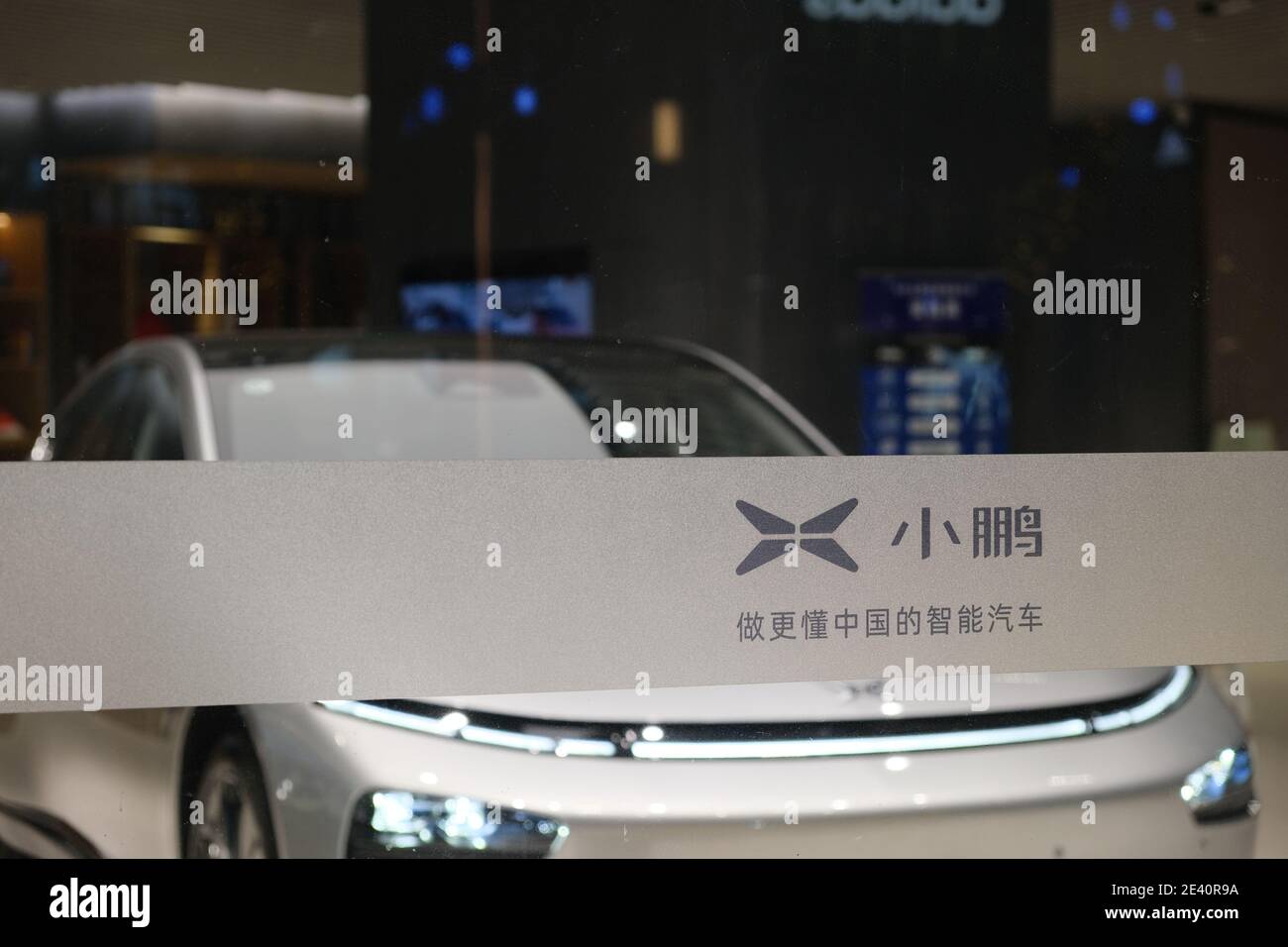 Shanghai.ChinaJan.2021 Xpeng Motors's logo on glass. Blur electric