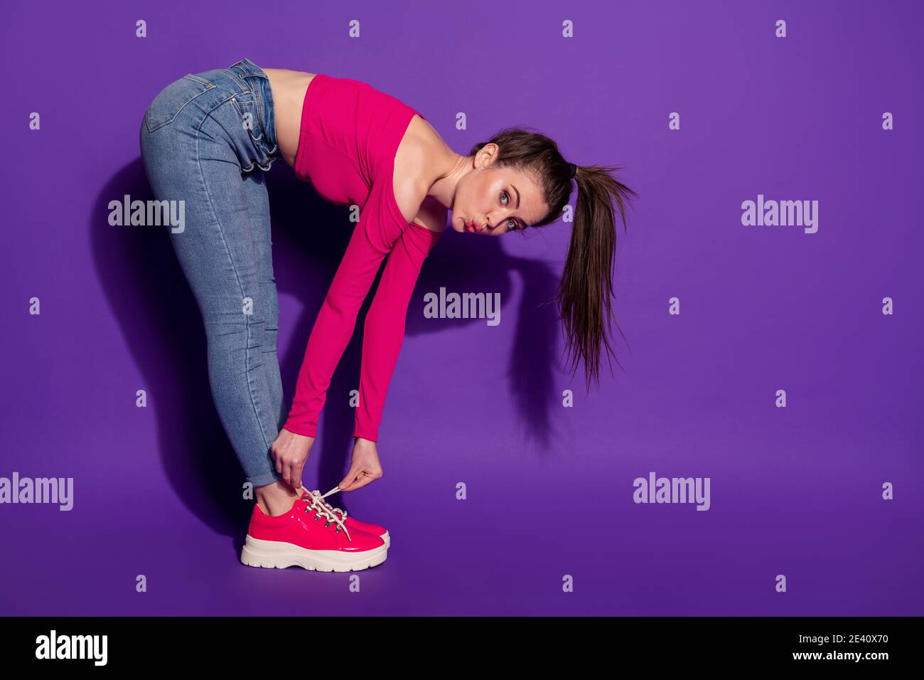 Female bend over hi-res stock photography and images - Alamy