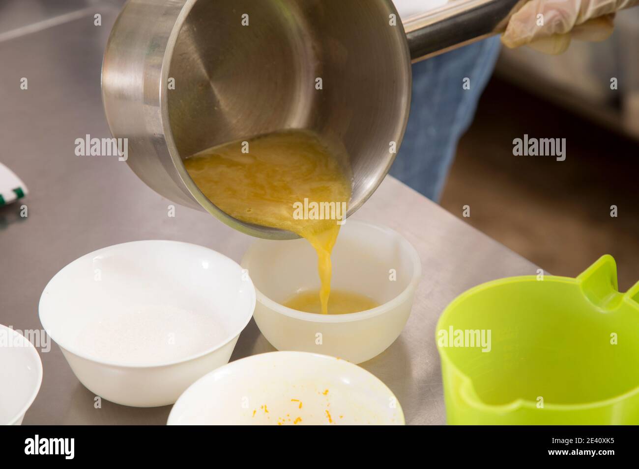 The process of making jelly from natural fruits. Heated fresh citrus fruit juice with sugar and agar. Stock Photo