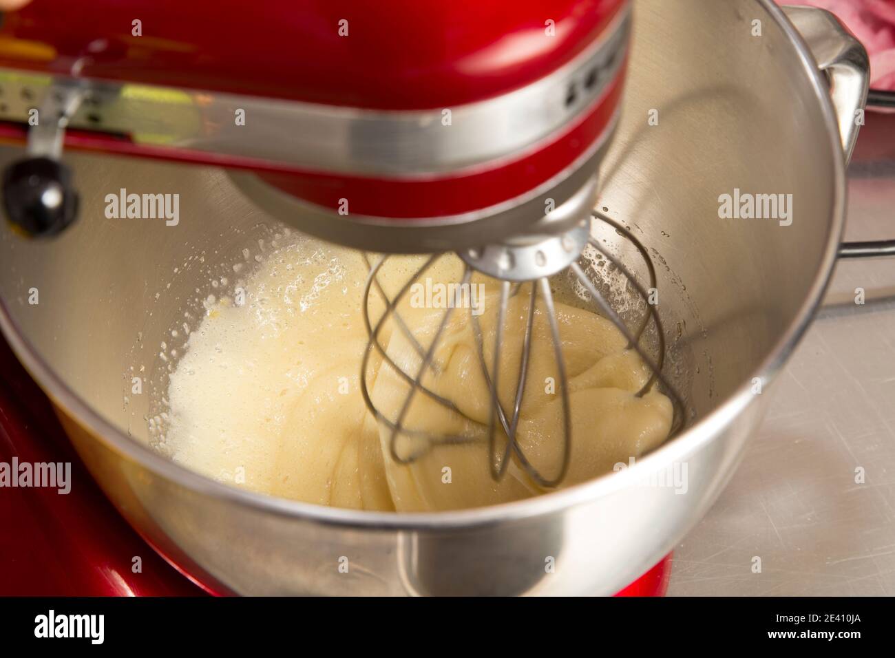 Blender the batter in a metal bowl. The process of making biscuit