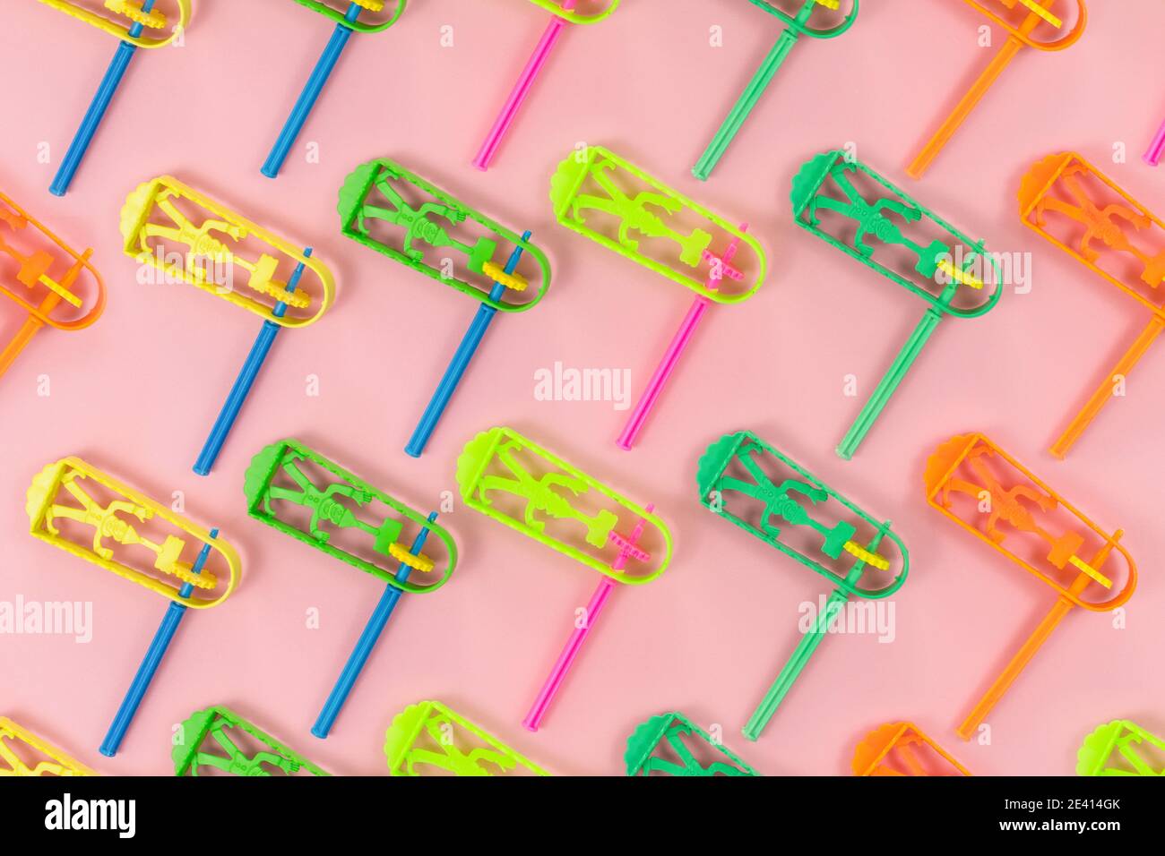 Top view of colorful Purim holiday items and toys on a pink background Stock Photo