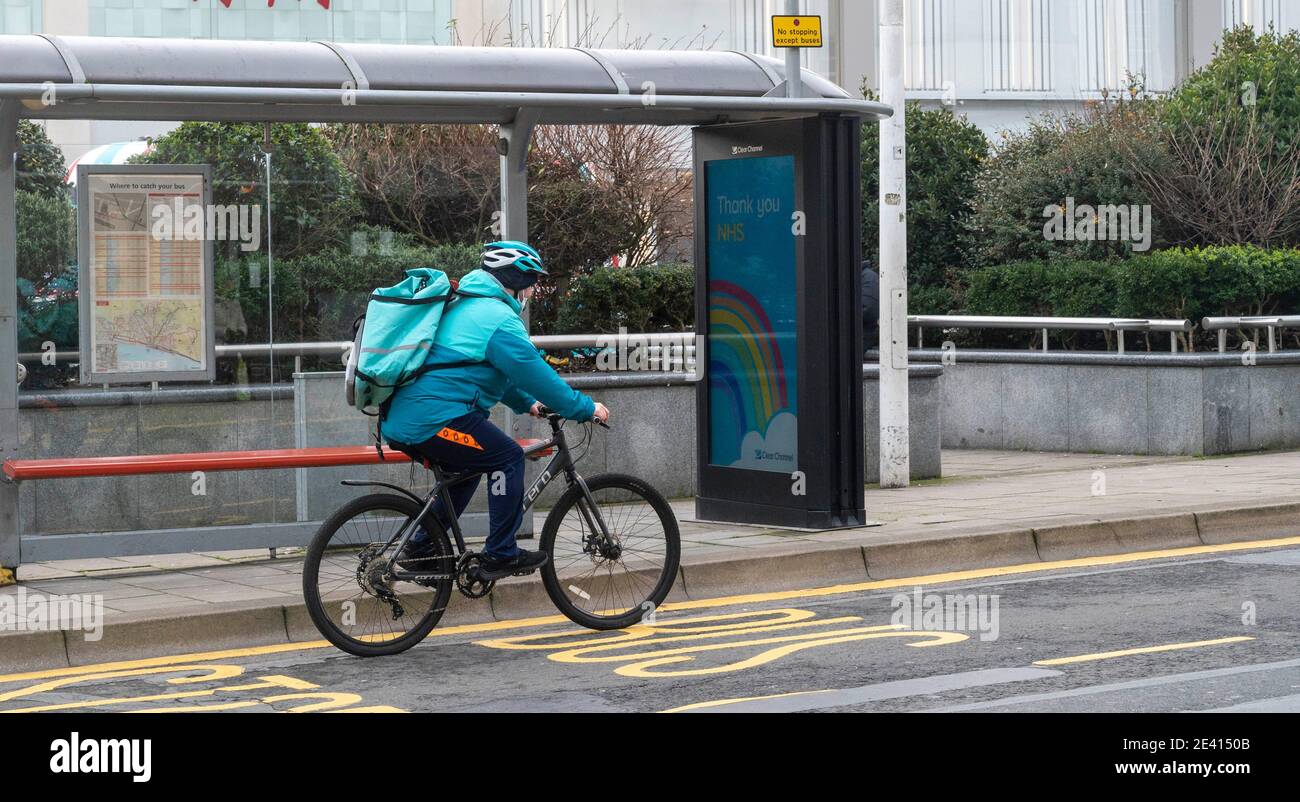 Deliveroo food delivery service cyclist in streets of Brighton UK Stock Photo