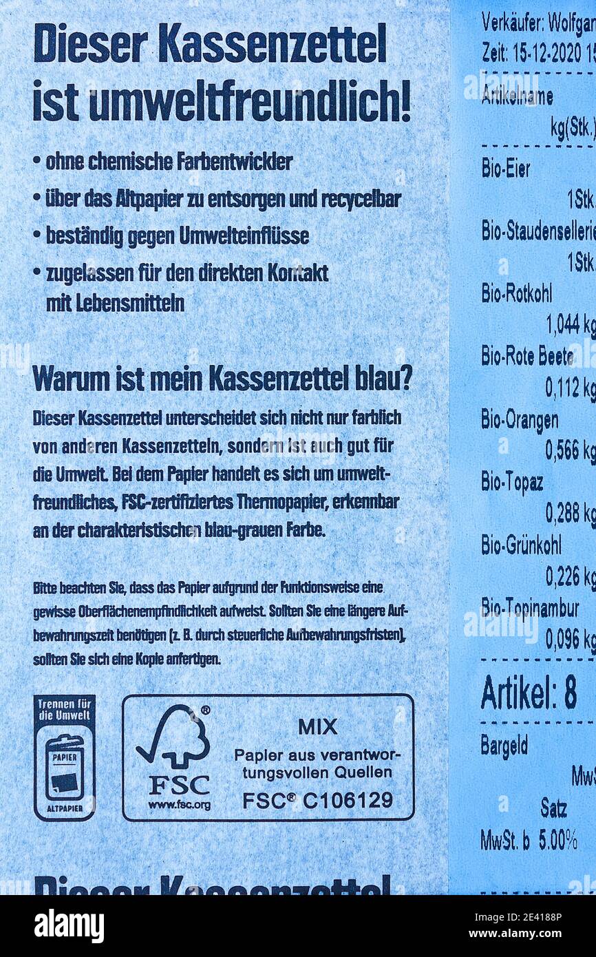 HAMBURG, GERMANY - December, 11, 2020: blue cash receipt paper, an ecological alternative to normal thermal paper. Stock Photo