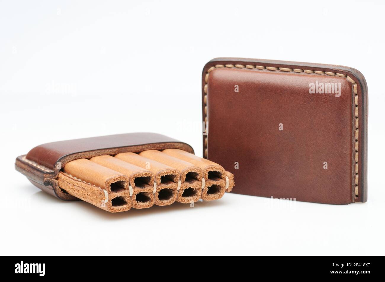 Leather cigarette holder with cap isolated on studio background Stock Photo 
